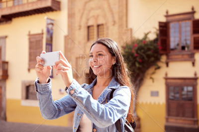 Long haired girl taking a picture