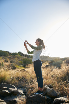 Lovely young girl taking a photo