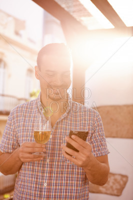 Man with beer in overexposed sun