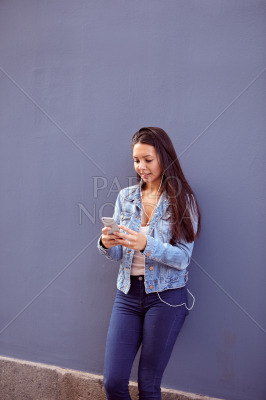 Pretty young girl reading a message