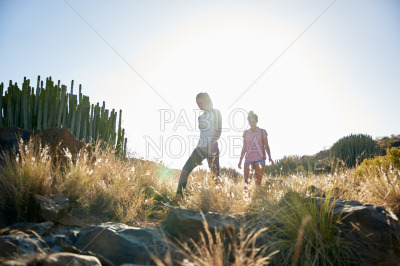 Two girls on a rocky hill