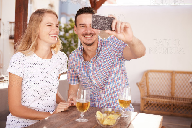 Handsome young couple taking a selfie