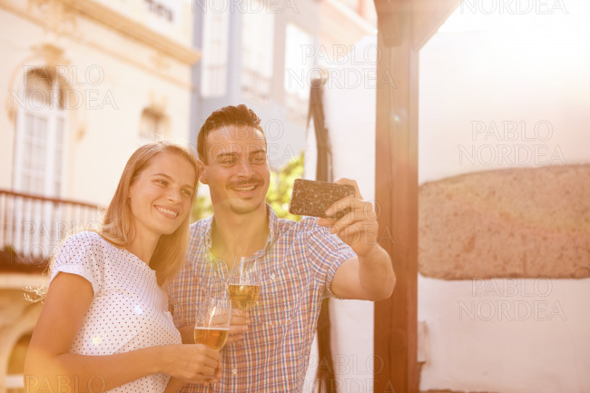 Happily smiling couple posing for selfie