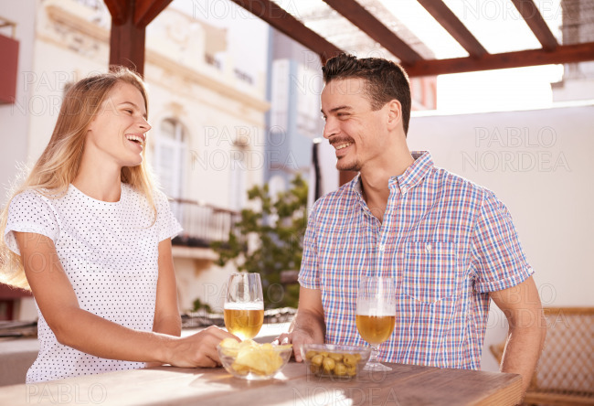Smiling couple meeting over some drinks