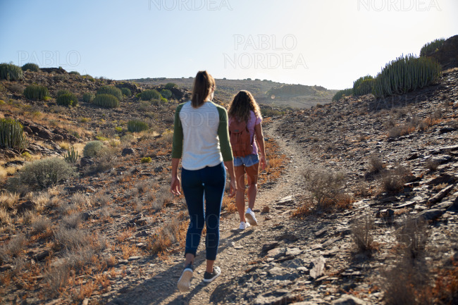 Young girls strolling up a pathway